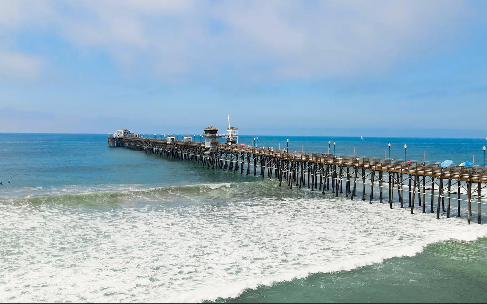 Oceanside Pier and Pacific surf, in coastal North County San Diego.